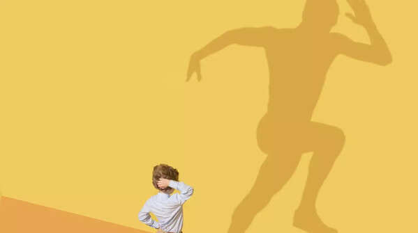Person reaching for the stars, representing dreams and actions.