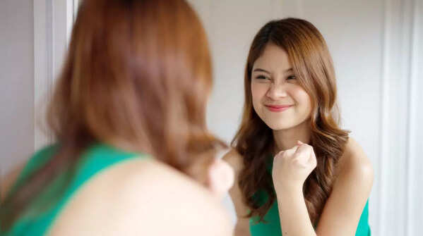 Reflection in a mirror, concept of self-talk.