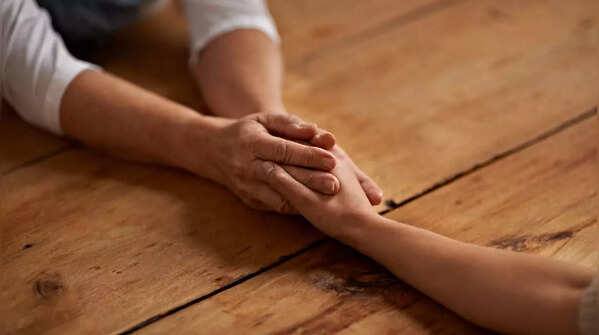 Two people comforting each other, showing empathy.