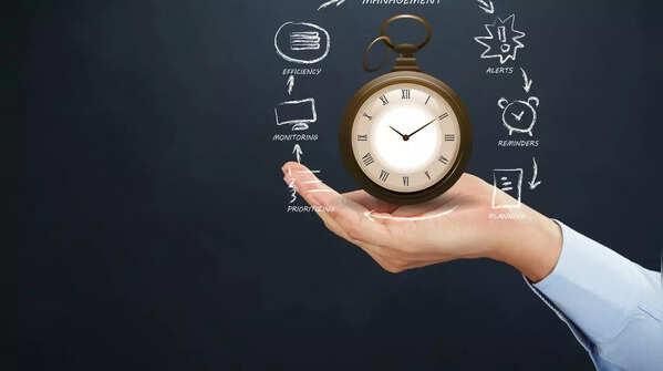 Person checking the time, emphasizing the importance of time management