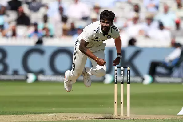 Reddy celebrates taking an early wicket.