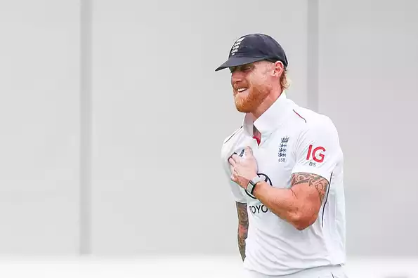 Stokes grimaces in pain while bowling.